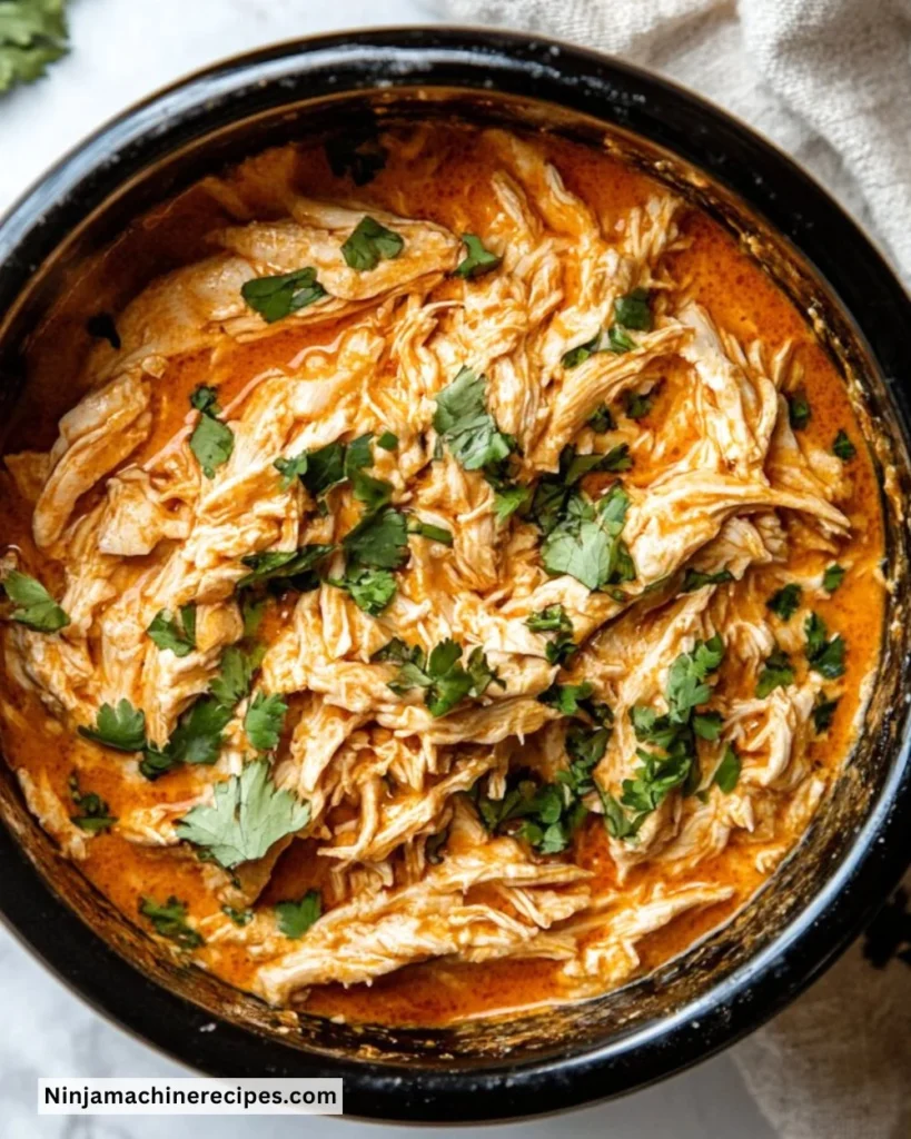 Crockpot Buffalo Chicken served with ranch dressing and celery sticks
