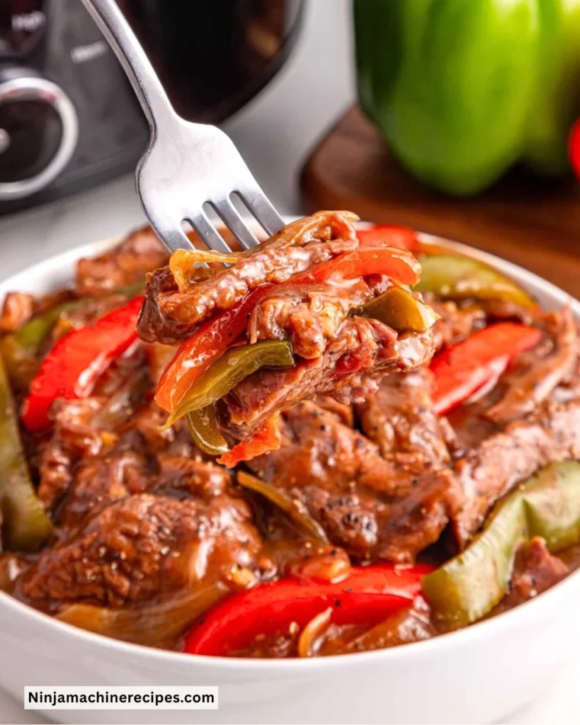 Crockpot pepper steak served with vegetables in a bowl