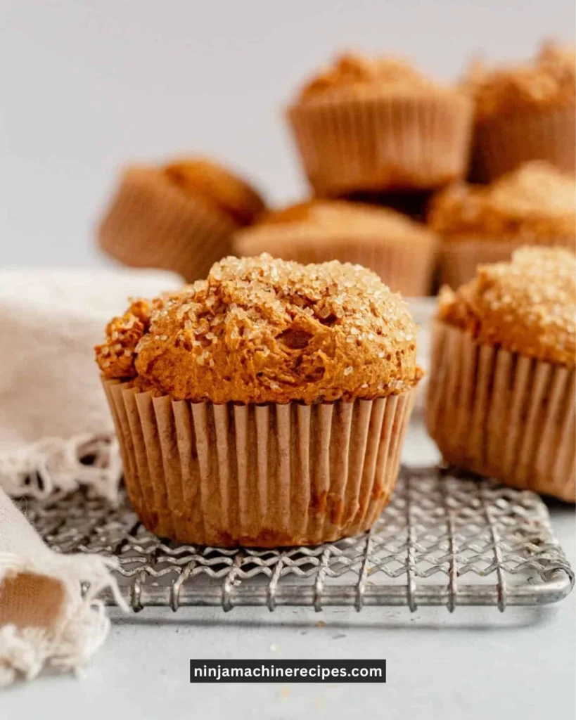 Delicious pumpkin muffins made with cake mix sprinkled with pumpkin seeds.