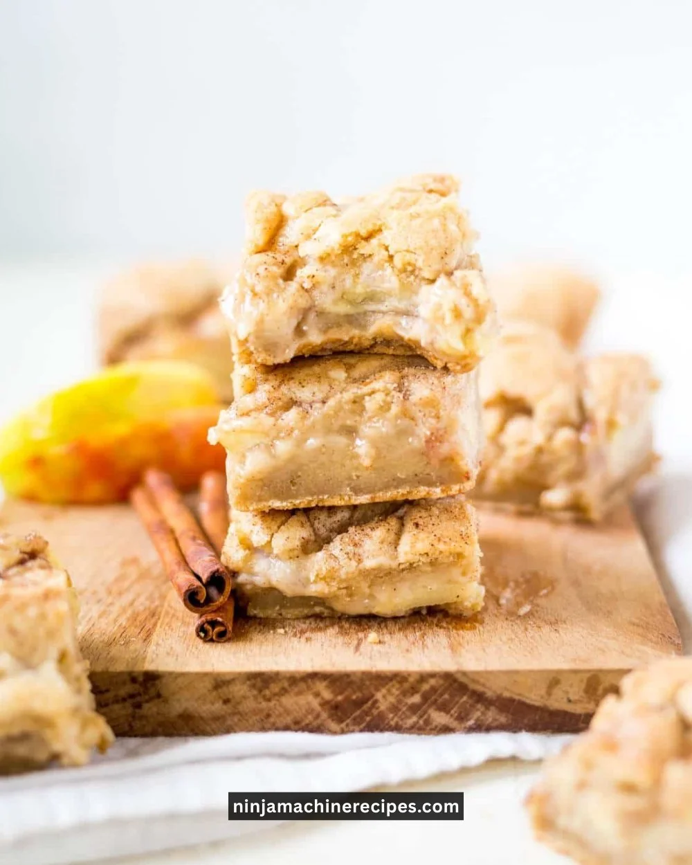 Delicious Snickerdoodle Apple Pie Bars topped with cinnamon and apple filling.