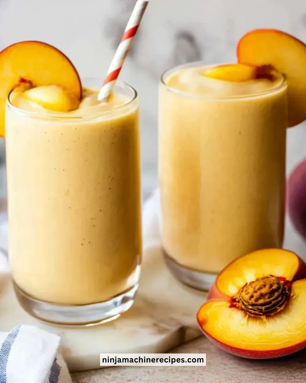 Delicious banana peach smoothies in a glass with fresh fruit