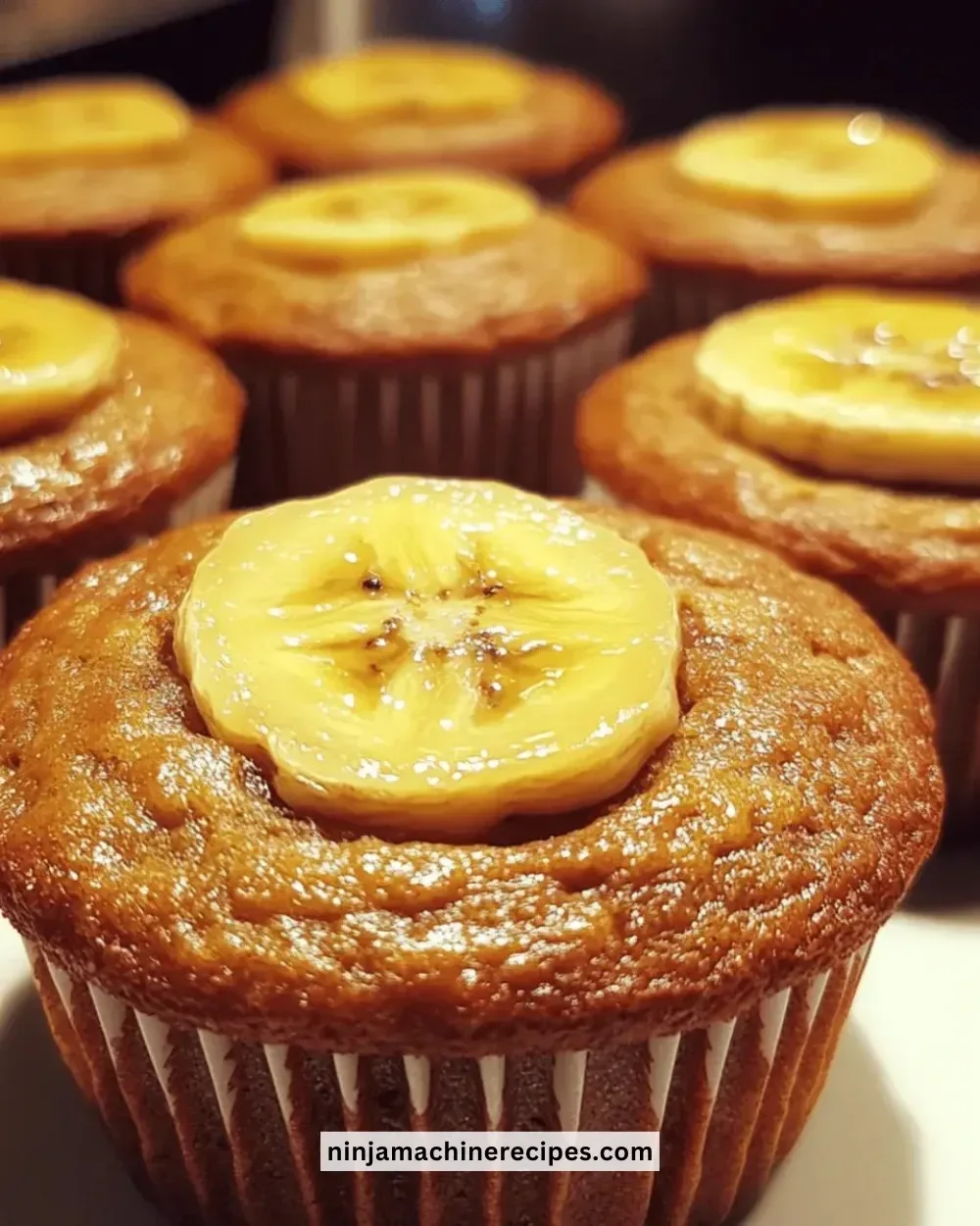 Freshly baked gluten-free banana muffins on a cooling rack.