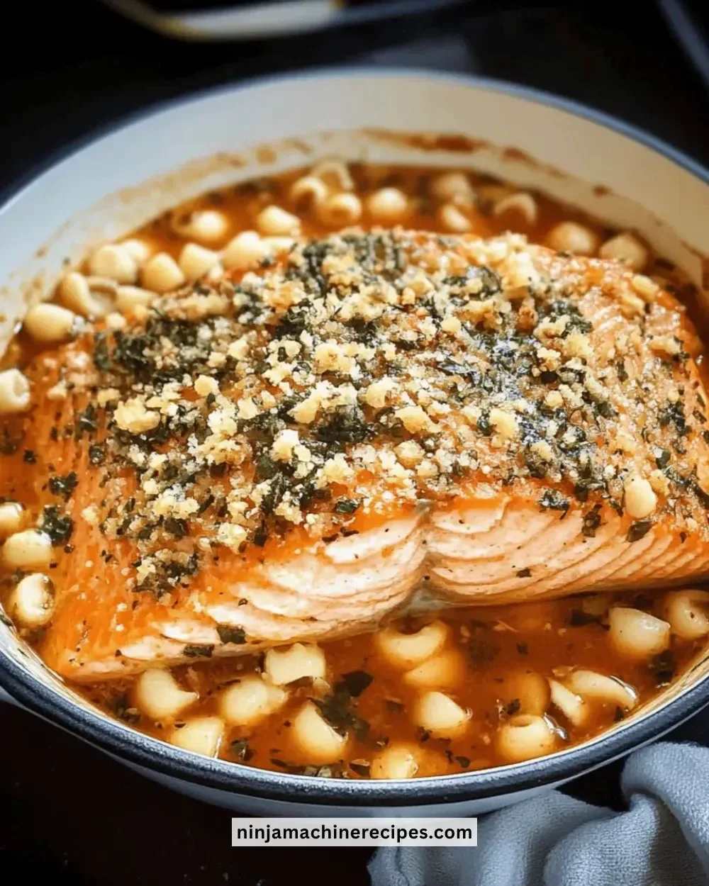 Delicious herb-crusted salmon garnished with fresh herbs on a plate