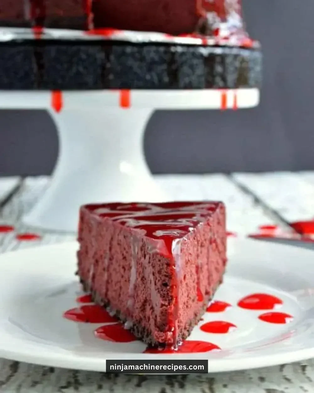 Sliced Bloody Good Cheesecake topped with strawberry glaze