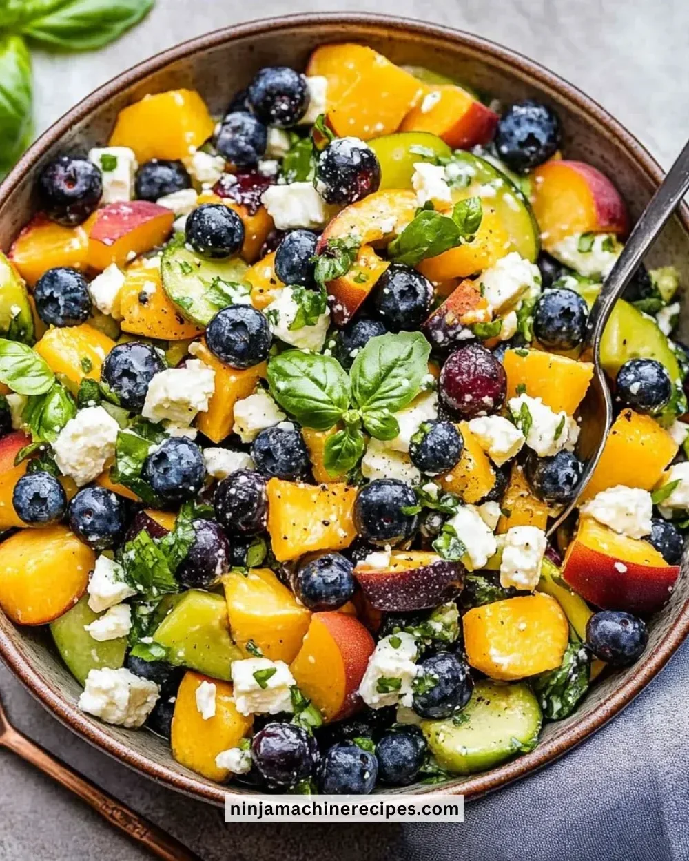 Colorful Blueberry Peach Feta Salad with fresh fruits and feta cheese