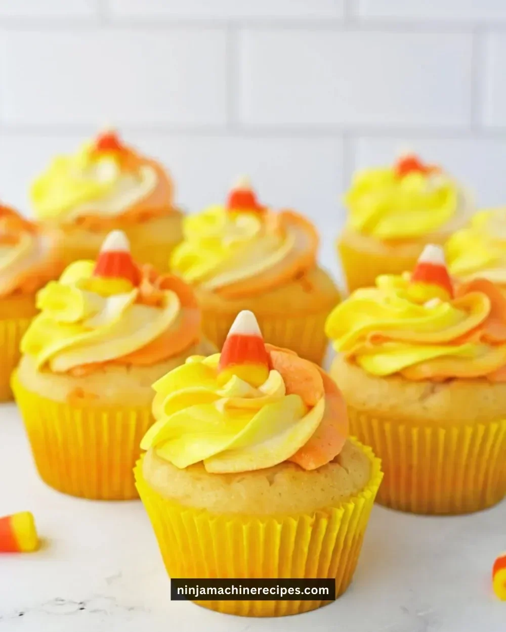Delicious Halloween Candy Corn Cupcakes topped with colorful frosting