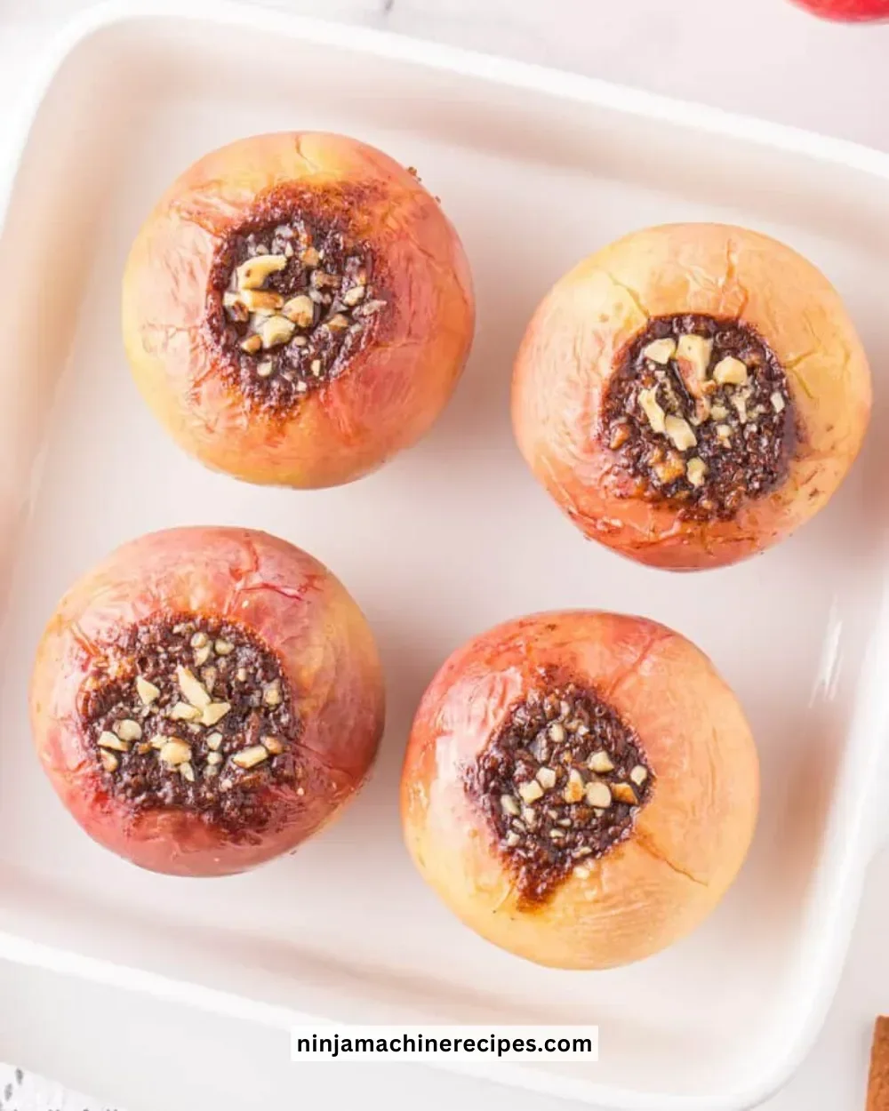 Delicious classic baked apples topped with cinnamon and nuts