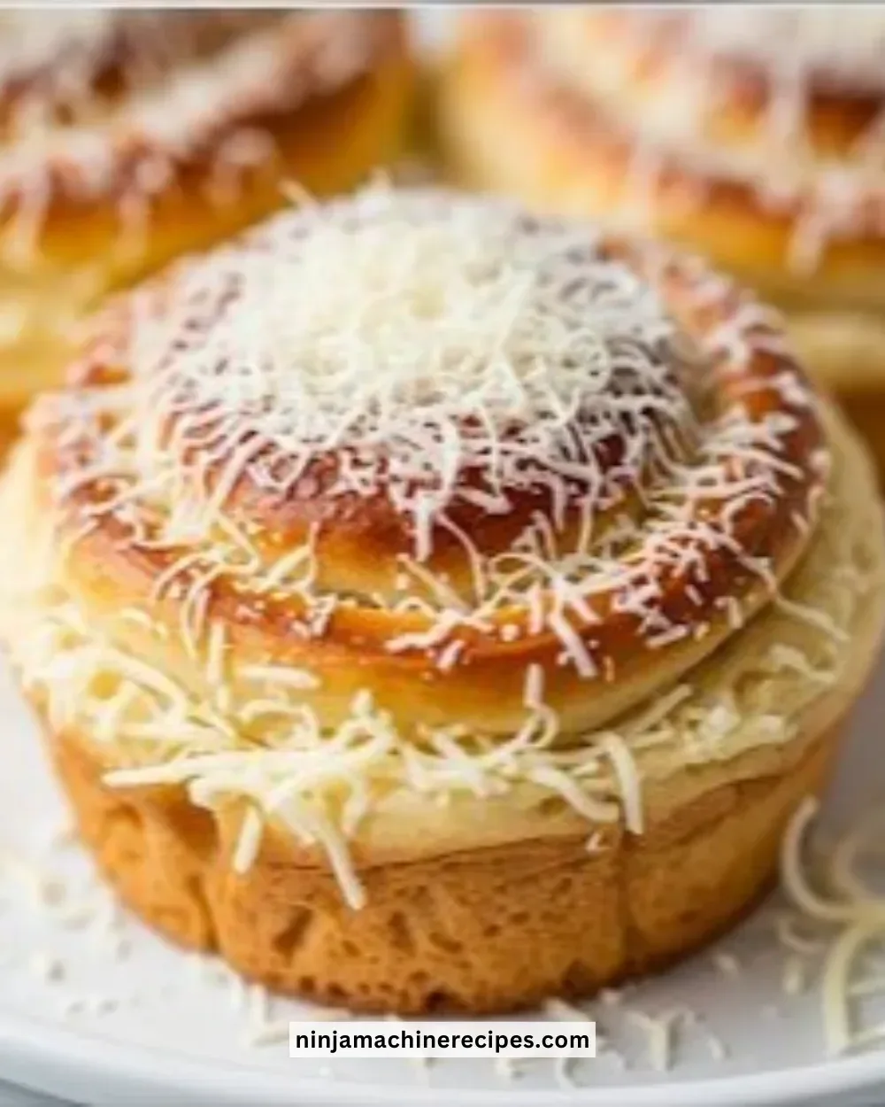 Classic Ensaymada Bread fresh out of the oven, showcasing its fluffy texture and buttery topping.