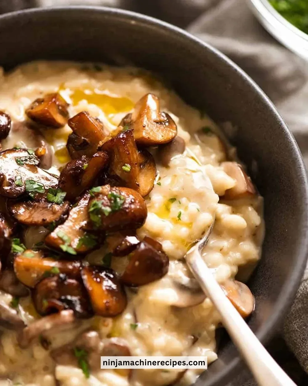 Plate of creamy mushroom risotto garnished with parsley and mushrooms