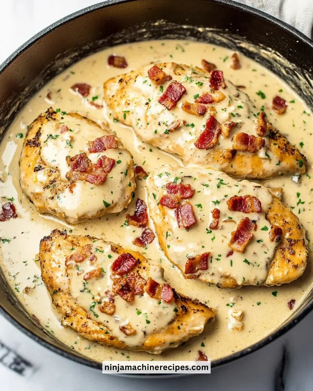 Creamy turkey bacon chicken dish with vegetables on a serving platter.