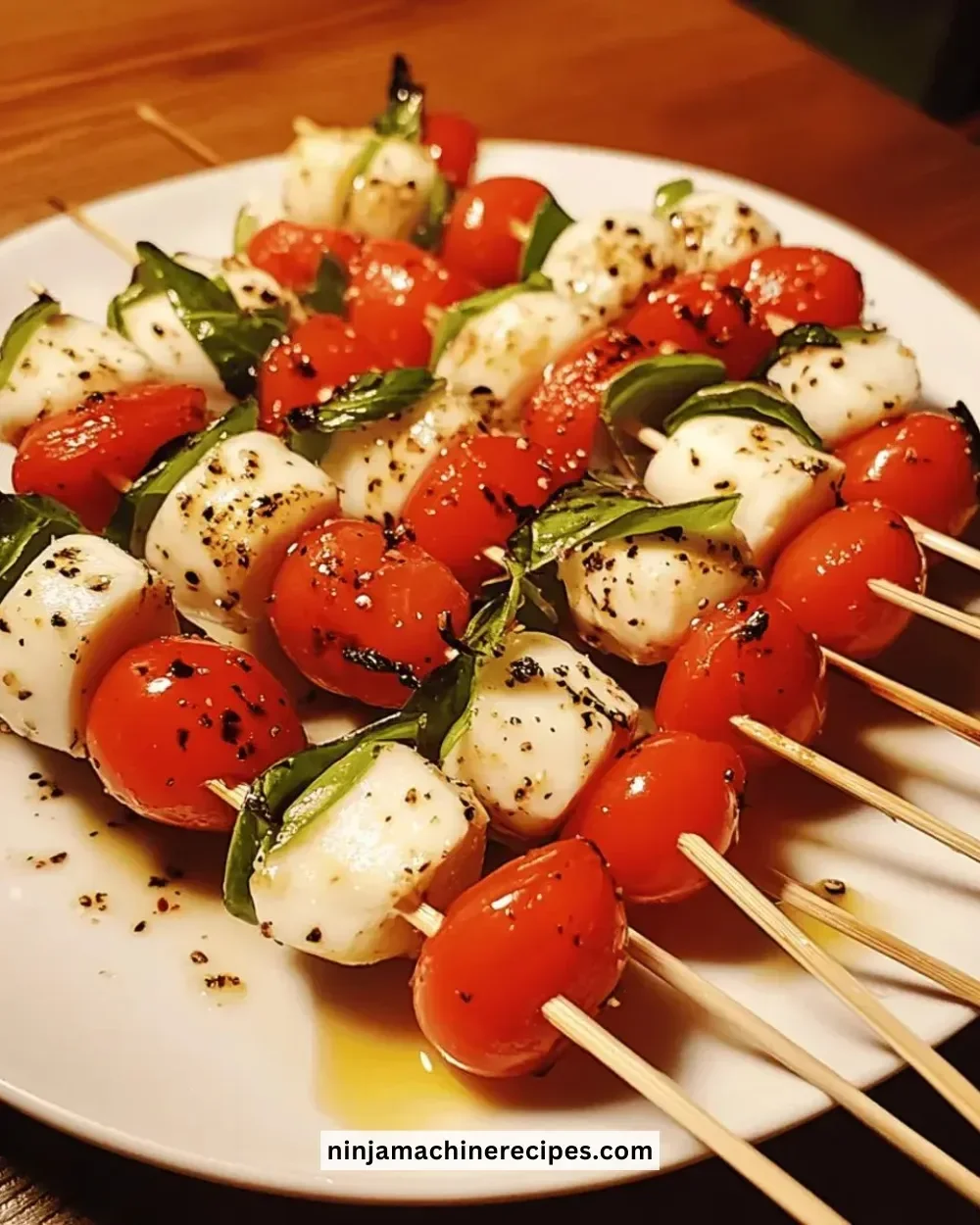 Easy Caprese skewers with mozzarella, tomatoes, and fresh basil on a platter