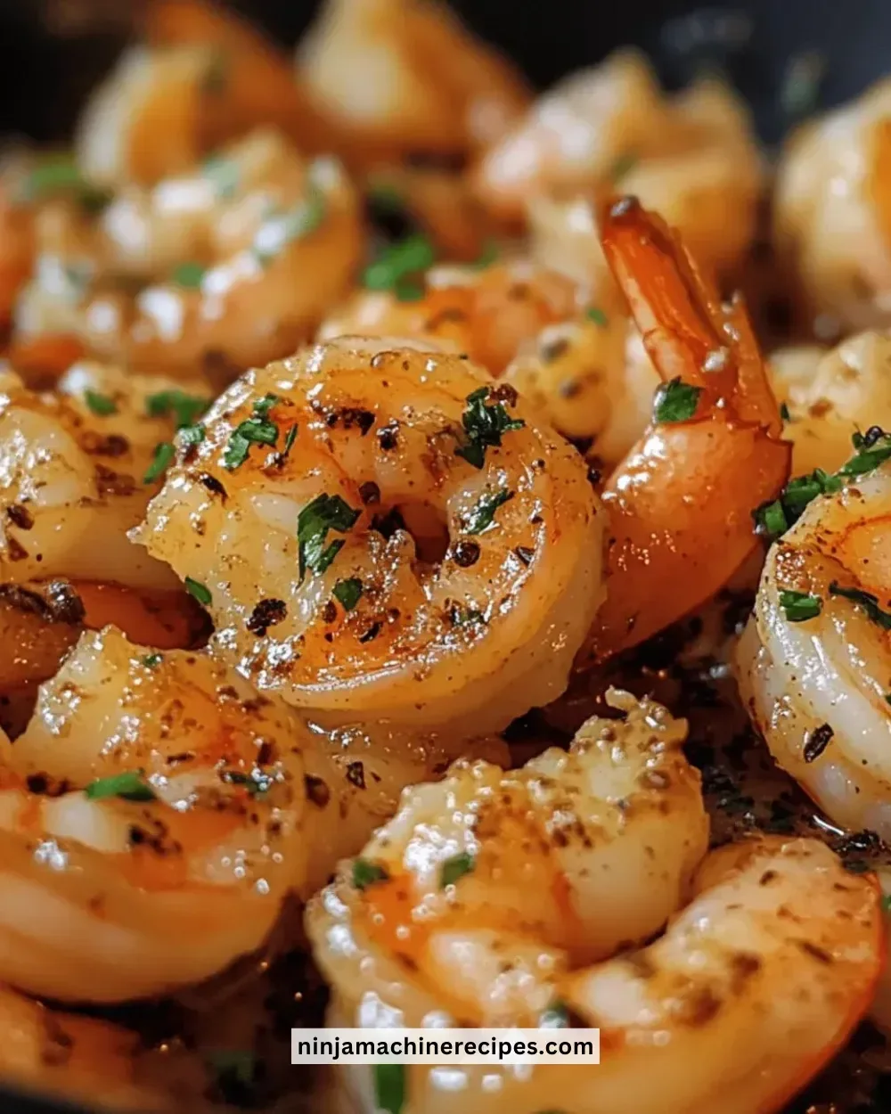 Plate of easy garlic butter shrimp with herbs and lemon garnish