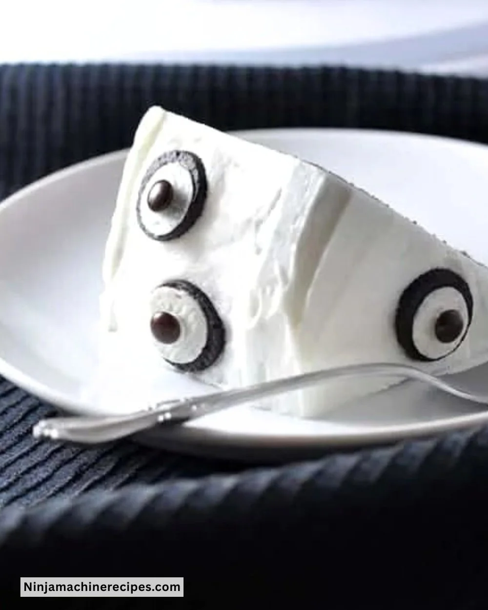 Easy Ghost Cake decorated with spooky frosting and candy eyes