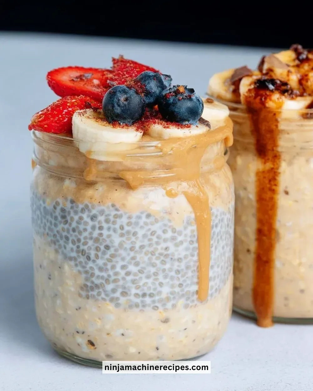 Bowl of easy high protein overnight oats topped with fresh fruit and nuts