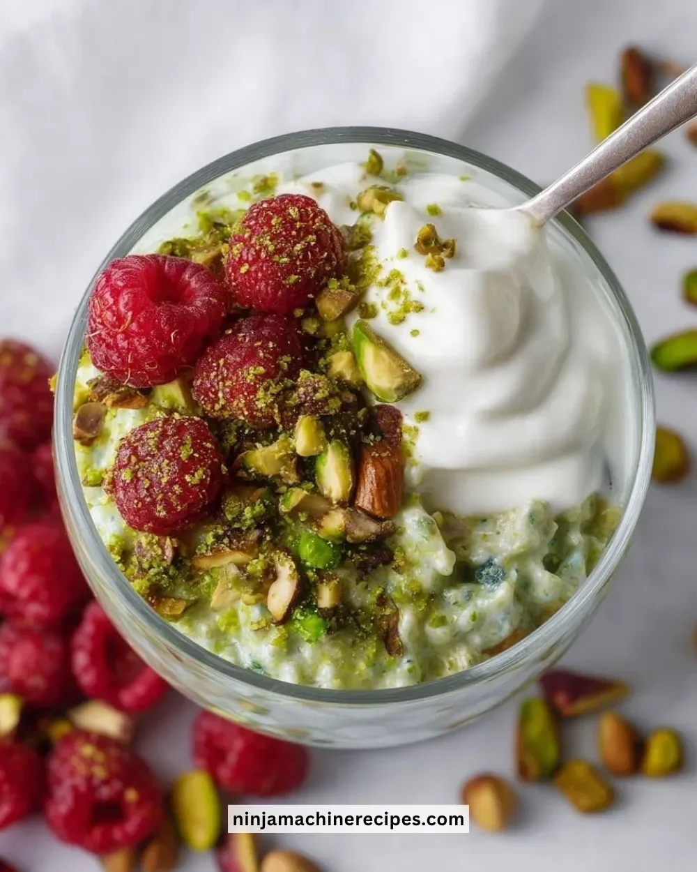 Delicious bowl of easy pistachio overnight oats topped with nuts and fruits