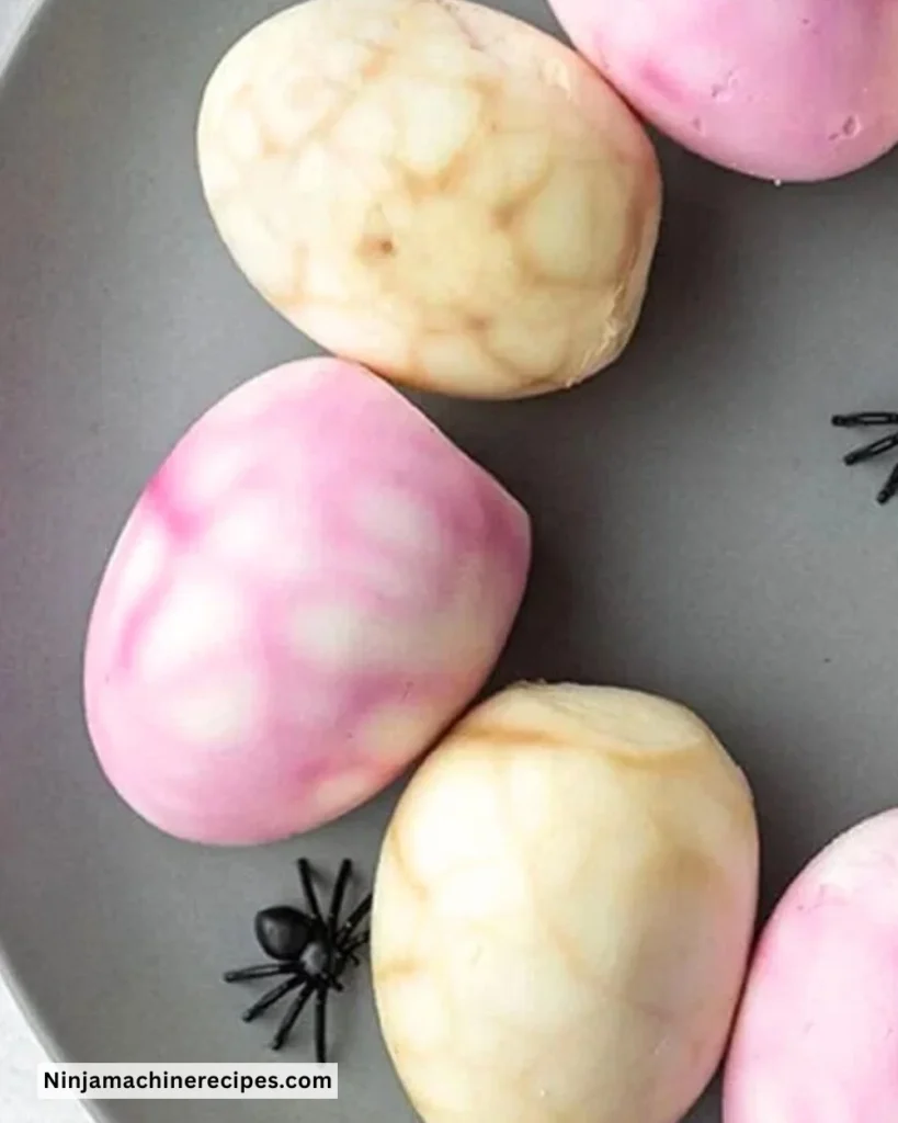 Colorful Halloween Spiderweb Eggs displayed for festive decoration.