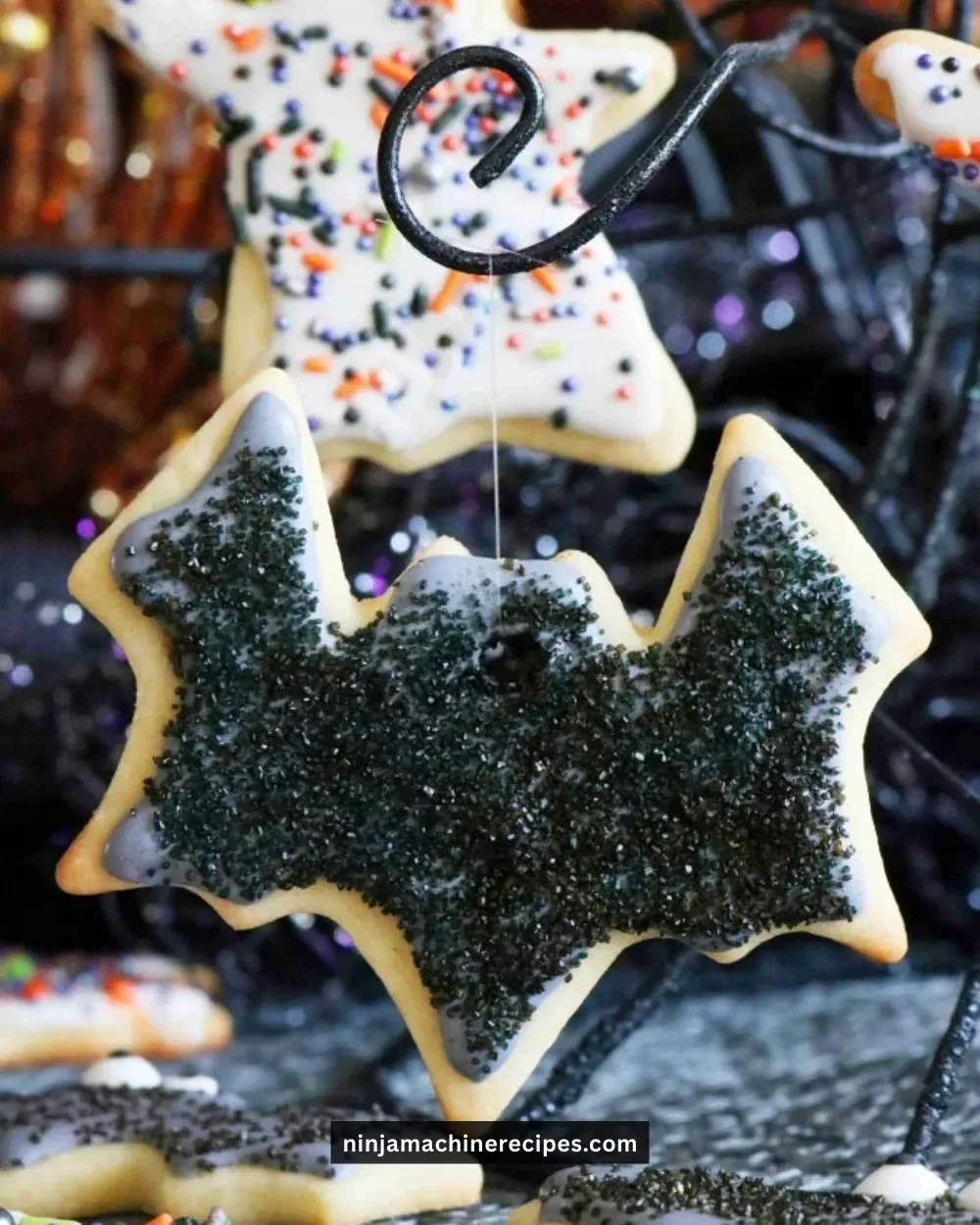 Decorated Halloween sugar cookies with spooky designs and colorful icing