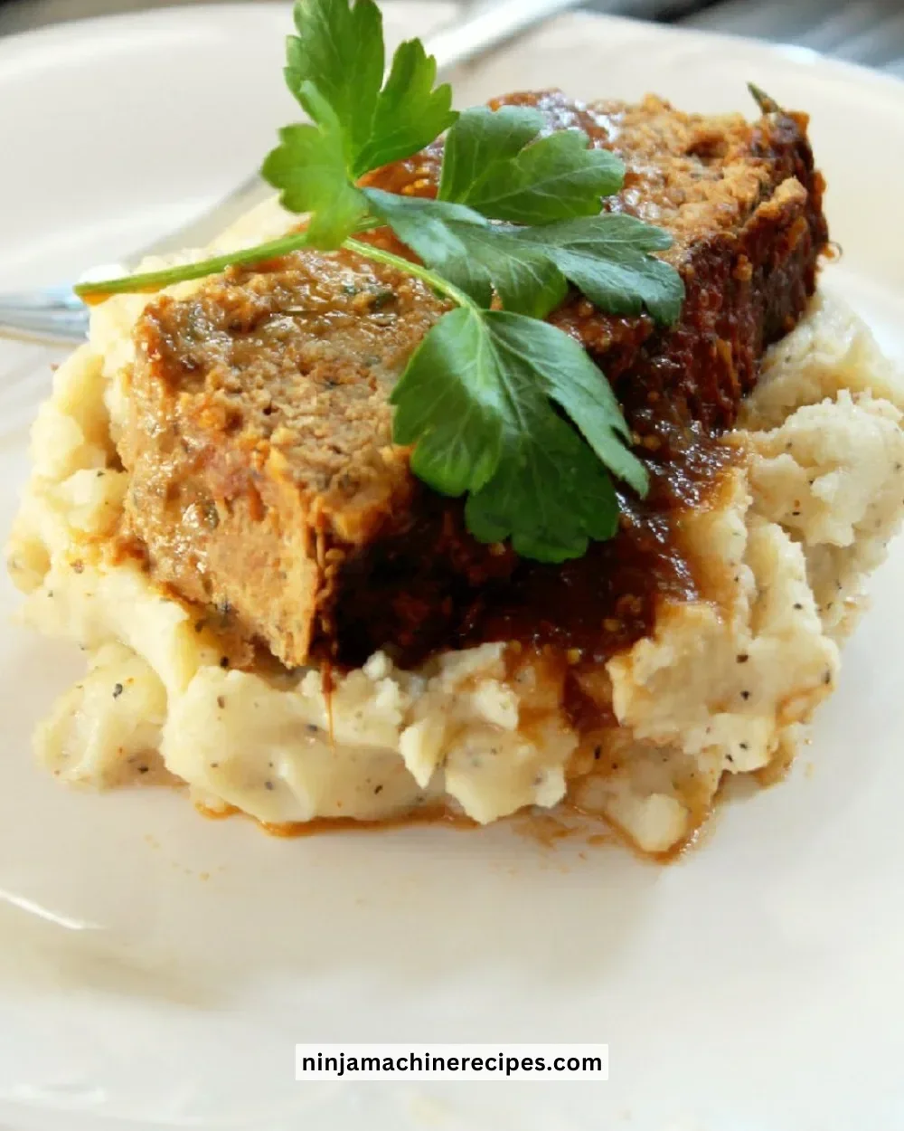 Meatloaf served with garlic mashed potatoes on a plate