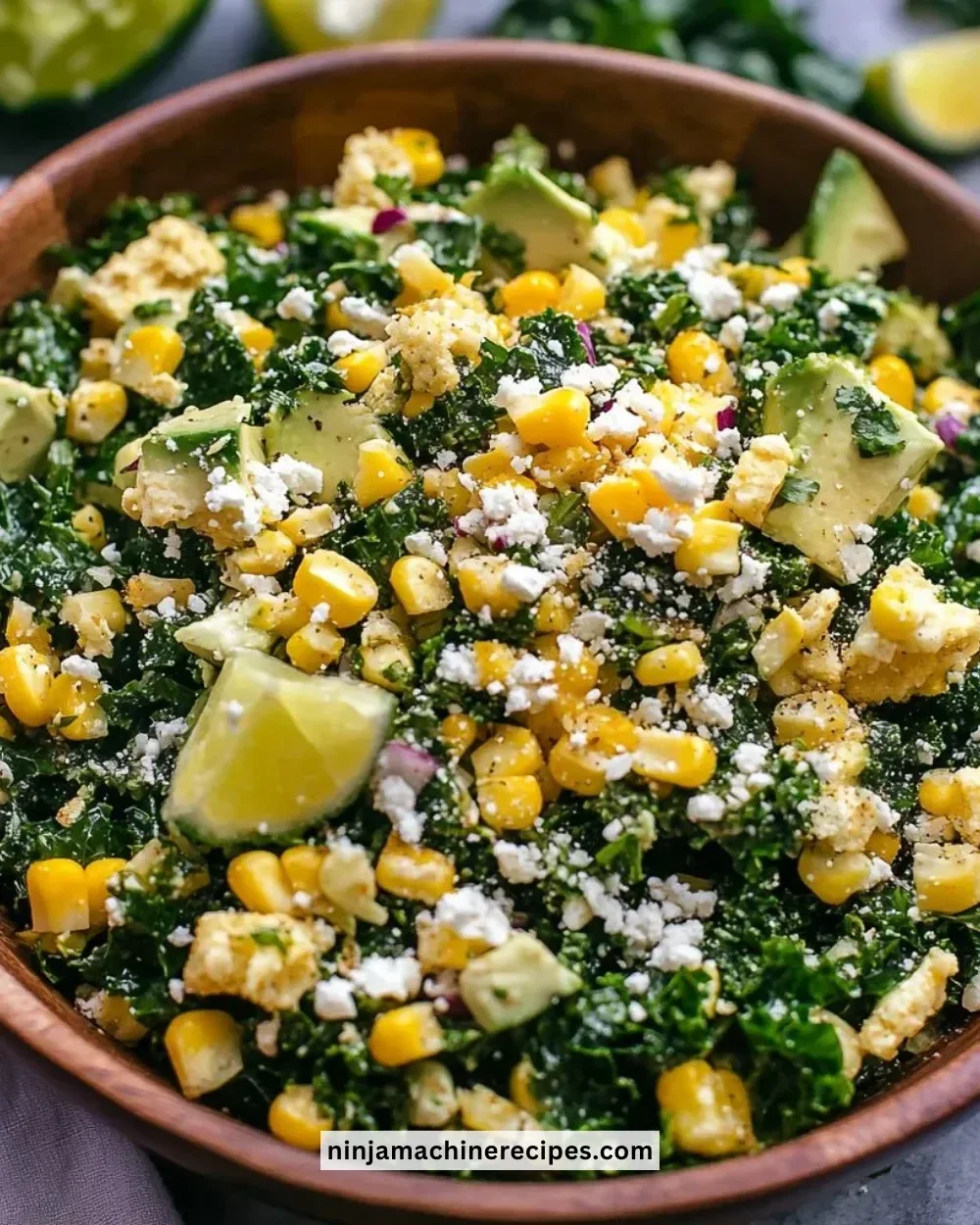 A delicious Mexican street corn kale salad topped with fresh herbs and cheese.