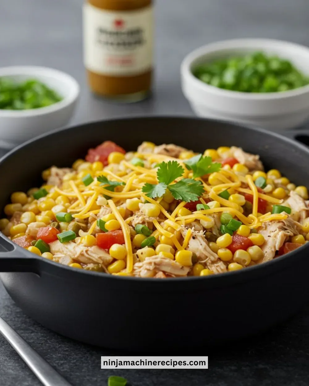 Bowl of Mexican Street Corn White Chicken Chili topped with cilantro and corn