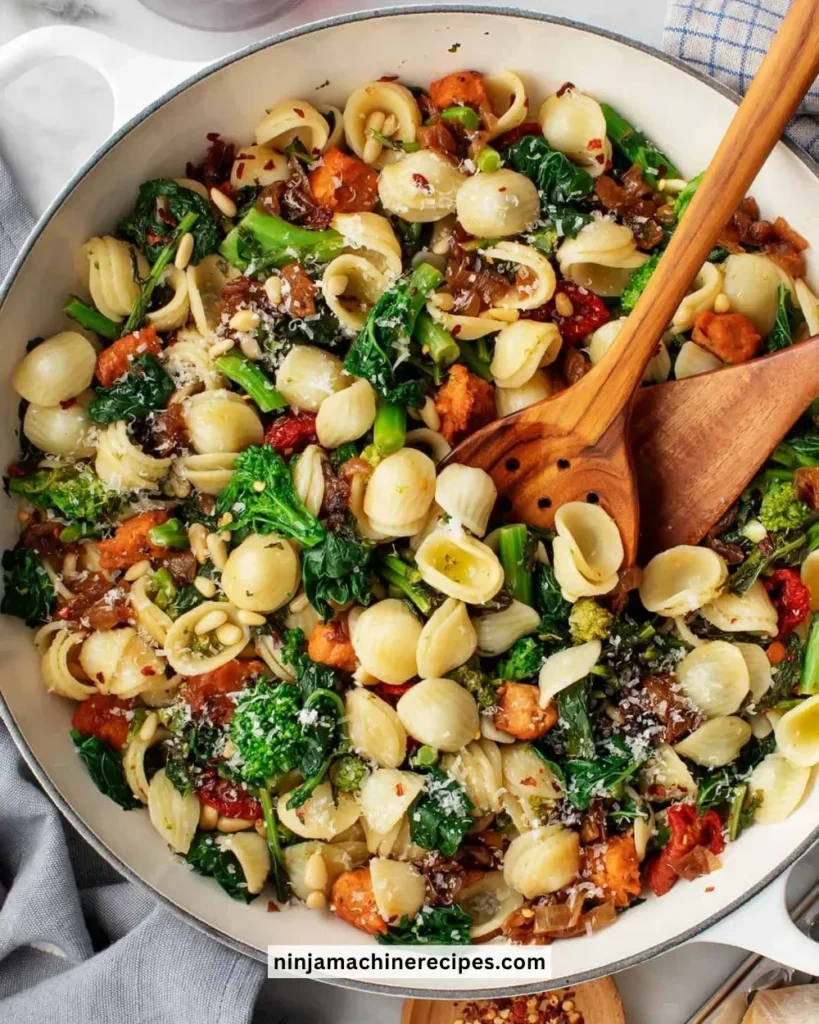 Plate of orecchiette pasta with broccoli rabe dish served in a rustic style