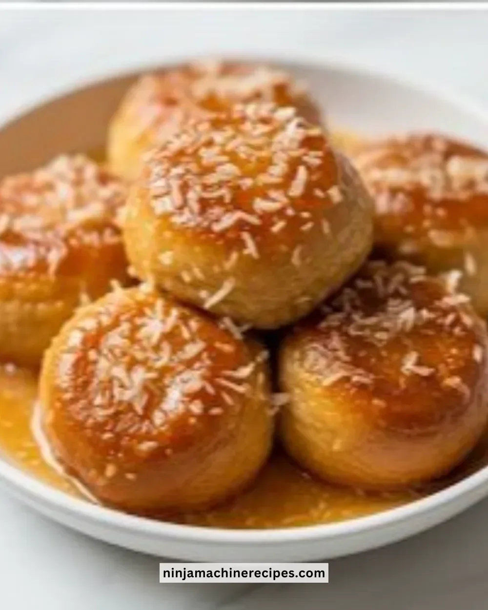 Pani Popo - Delicious Samoan coconut buns served on a rustic plate.