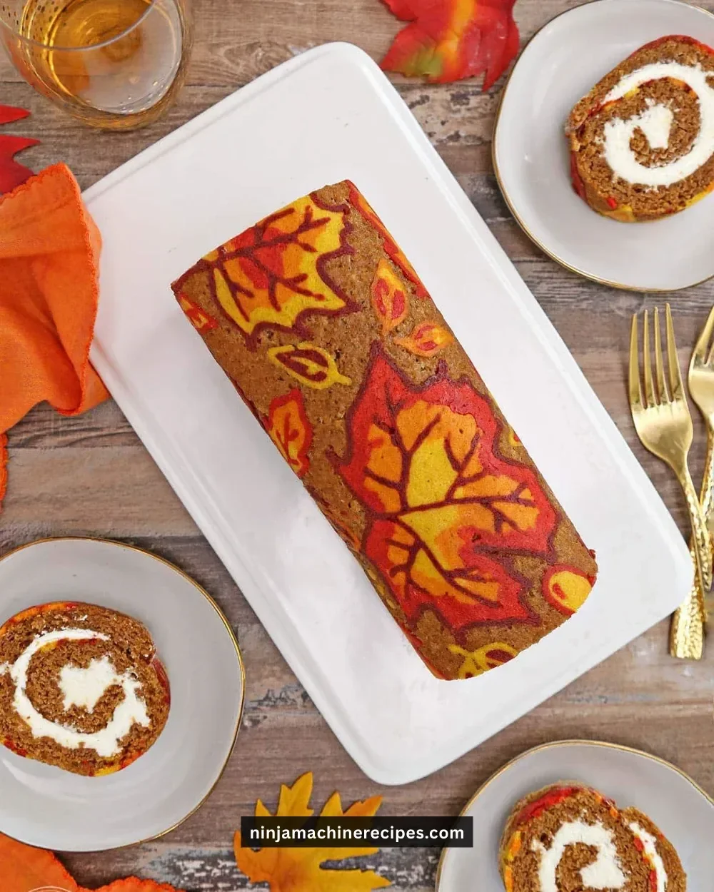 A beautifully patterned pumpkin roll, showcasing vibrant orange and cream colors.