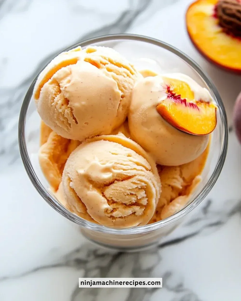 Delicious Peach Greek frozen yogurt served in a bowl with fresh peach slices