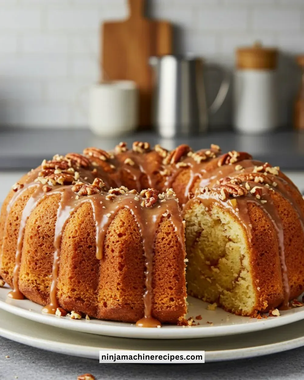 Pecan Caramel Cinnamon Roll Cream Cheese Pound Cake with swirls and nuts