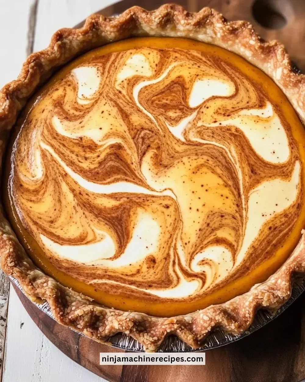 Delicious Pumpkin Mascarpone Pie topped with whipped cream