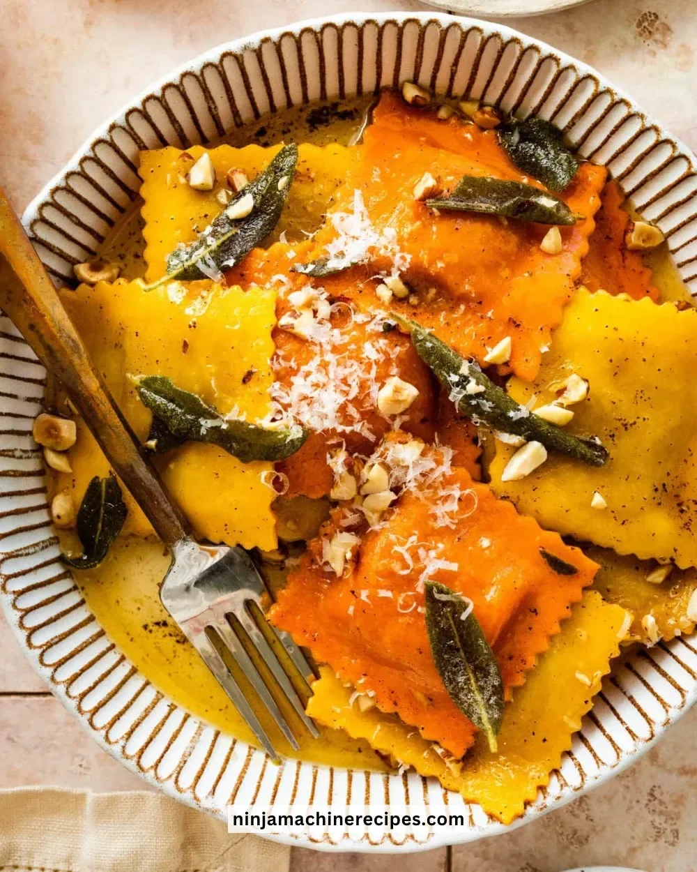 Delicious Pumpkin Ravioli with Sage Butter served on a plate