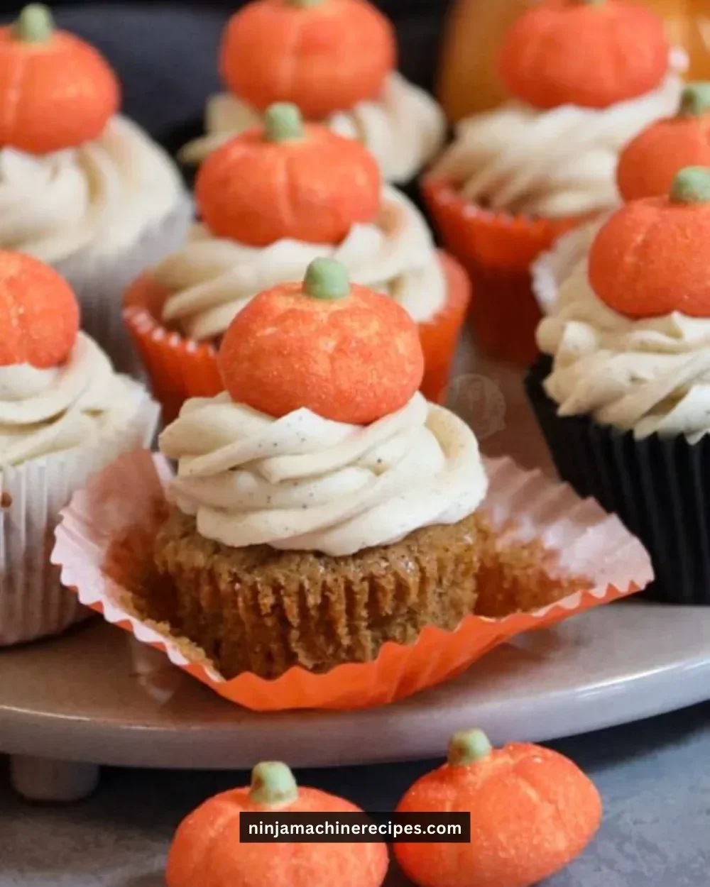 Delicious Pumpkin Spice Cupcakes topped with cream cheese frosting