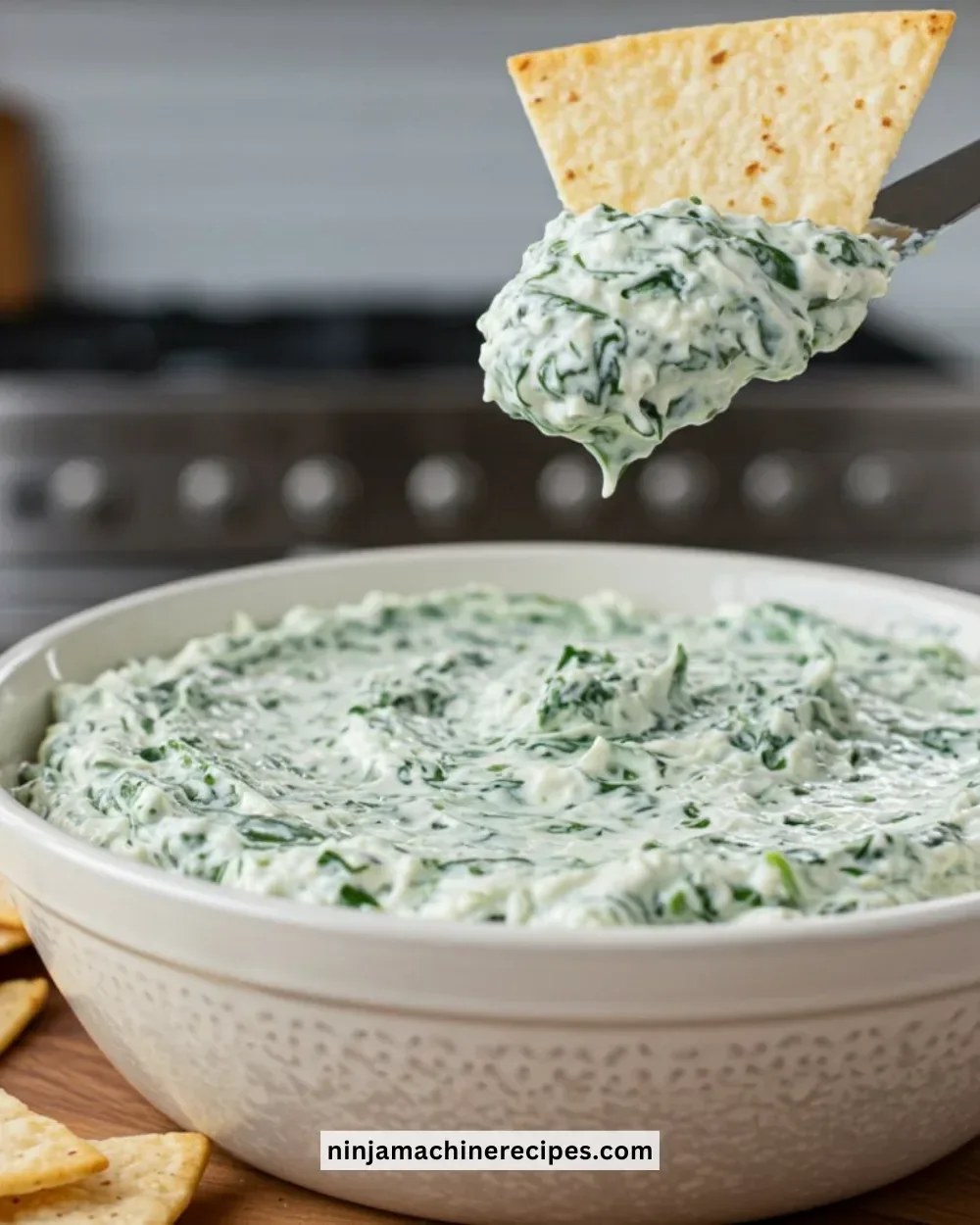 Creamy spinach dip served with tortilla chips for a delicious appetizer
