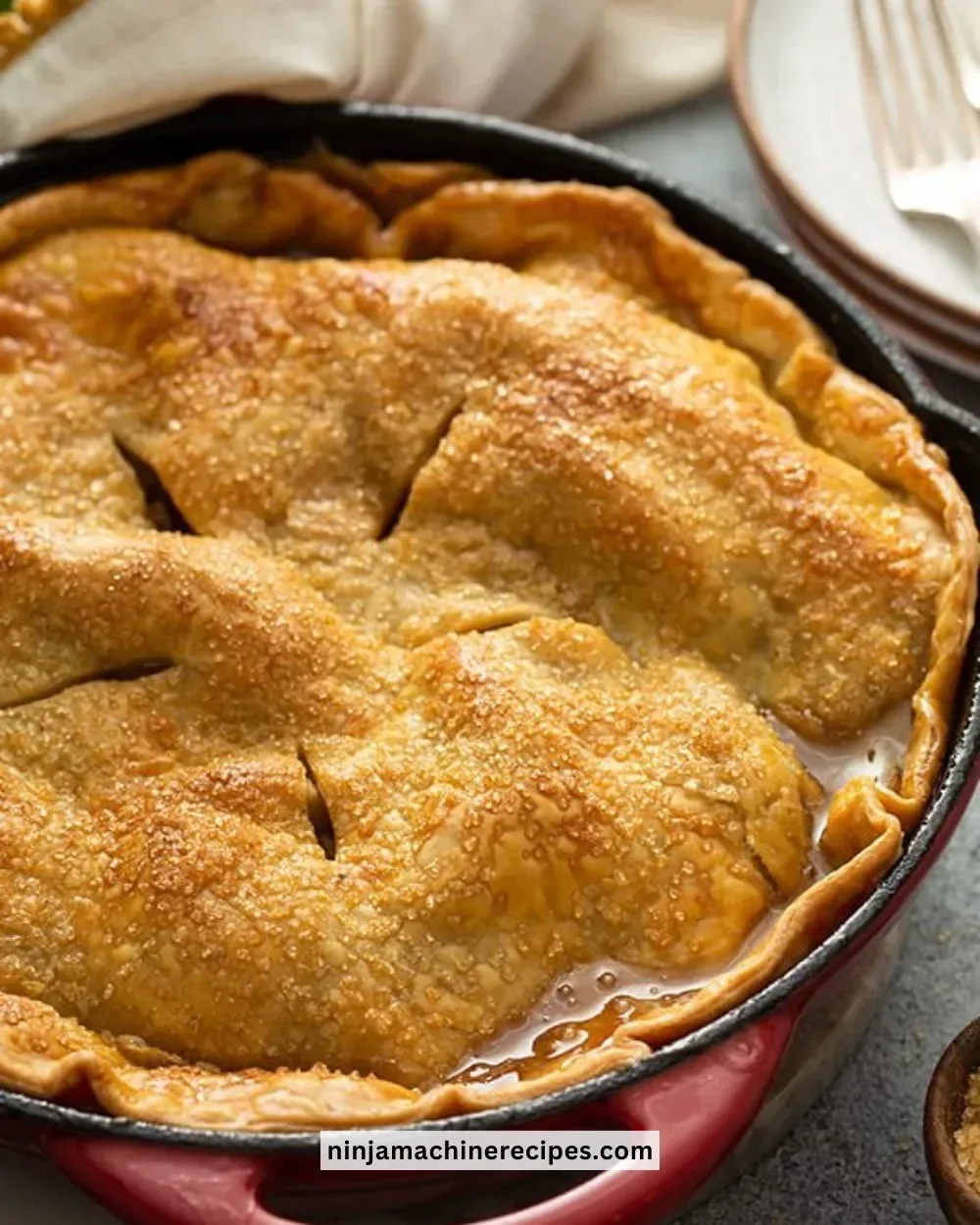 Delicious homemade apple pie with golden crust and fresh apples