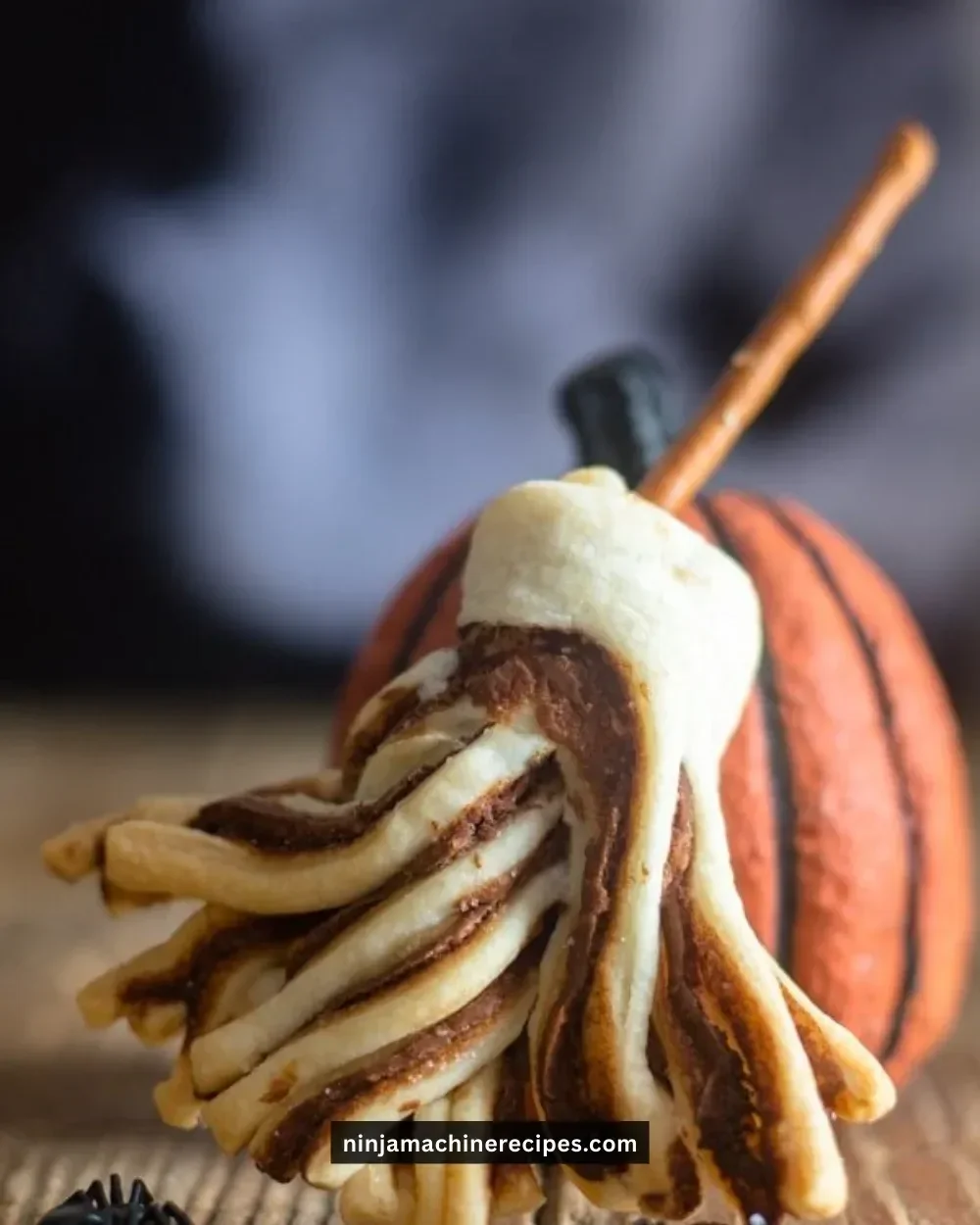 A plate of Witches' Brooms Puff Pastry decorated for Halloween
