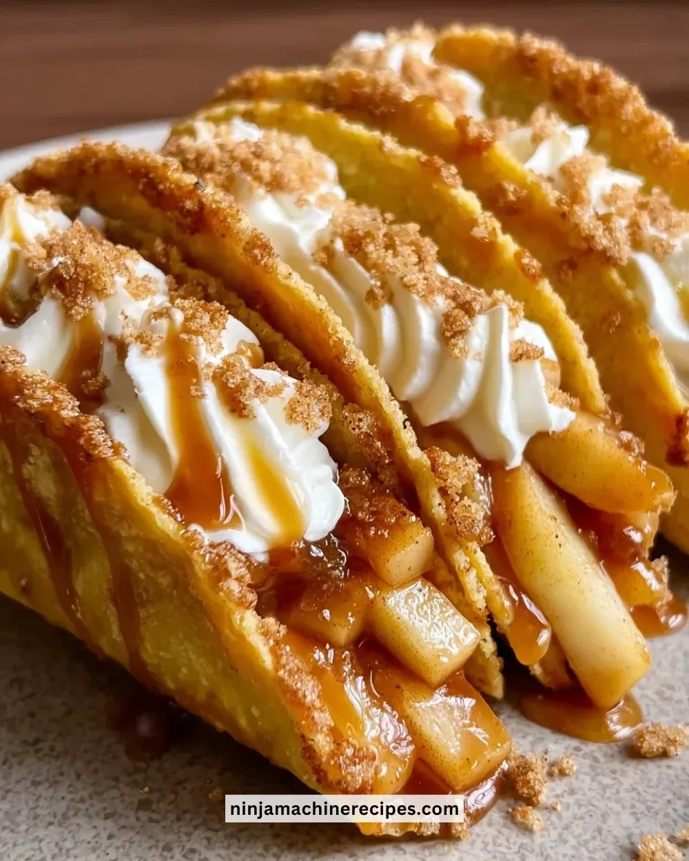 Delicious apple cheesecake tacos served on a plate with garnishes