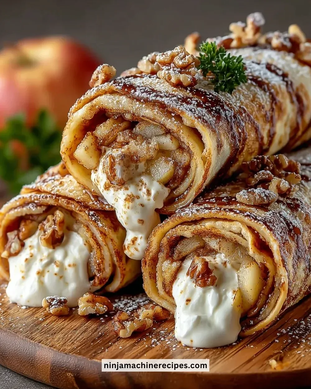 Delicious apple cinnamon roll-ups with a golden-brown crust and apple filling.