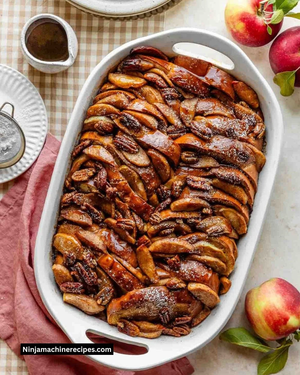 Delicious baked apple cider French toast topped with cinnamon and apples