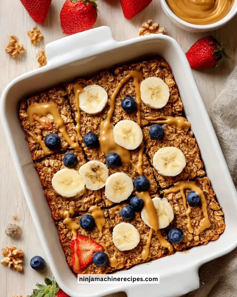 Healthy banana baked oatmeal topped with slices of banana and nuts