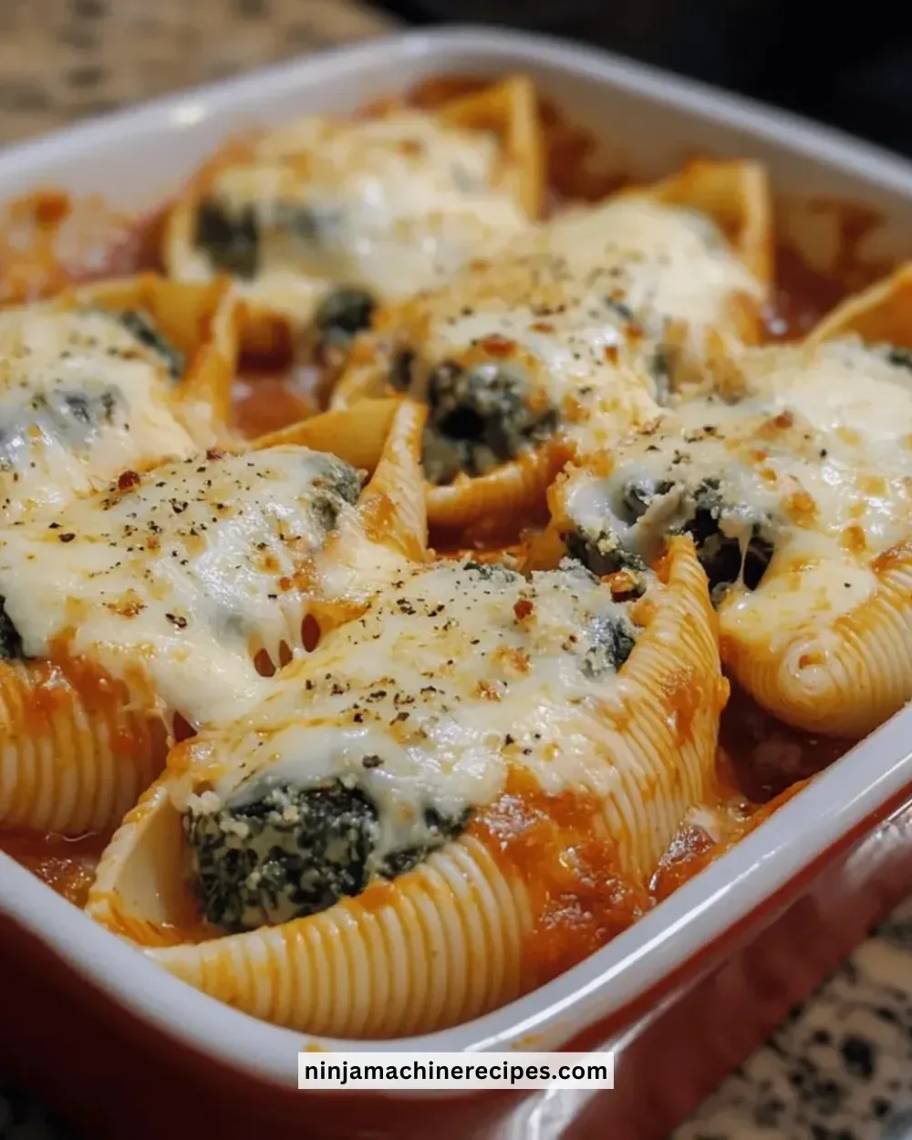Delicious easy cheesy spinach stuffed shells ready to serve