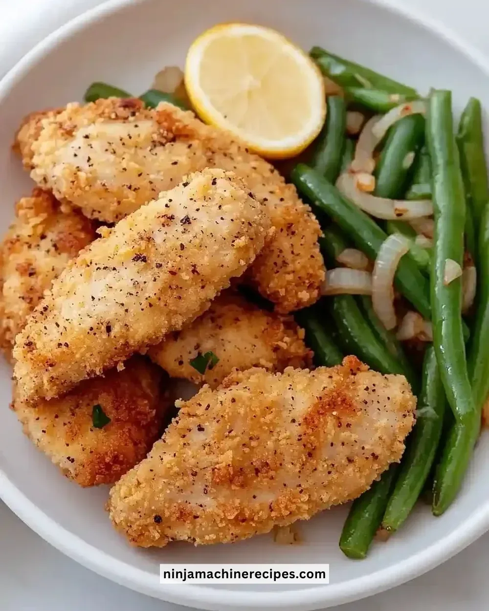 Golden fried chicken served on a plate, crispy and flour-free