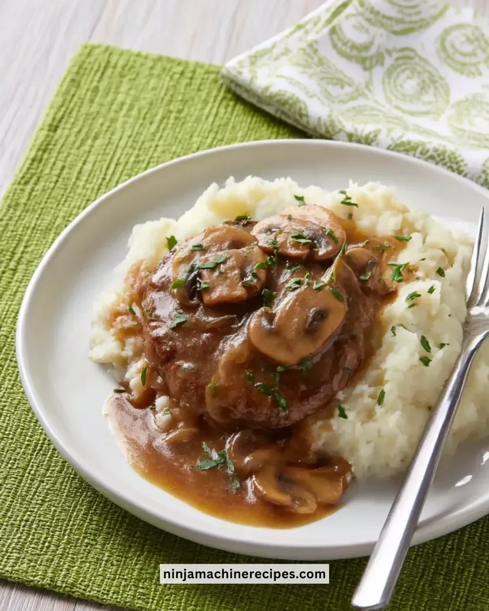 Juicy hamburger steaks smothered in onion and mushroom gravy