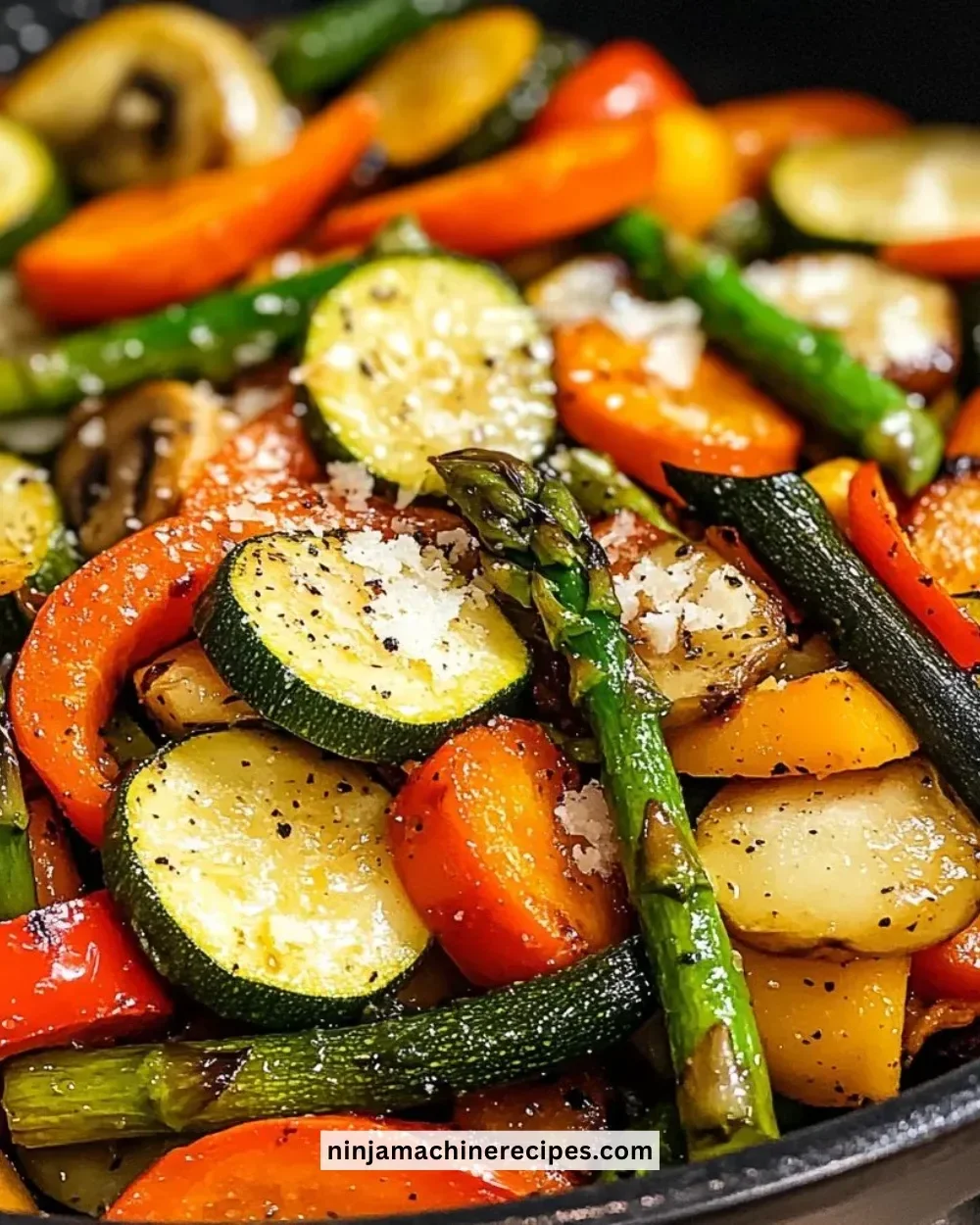 Plate of colorful healthy sautéed vegetables including bell peppers, broccoli, and carrots.