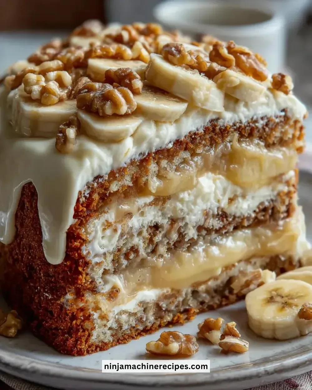 Heavenly Banana Walnut Cream Cake topped with delicious walnuts and creamy frosting