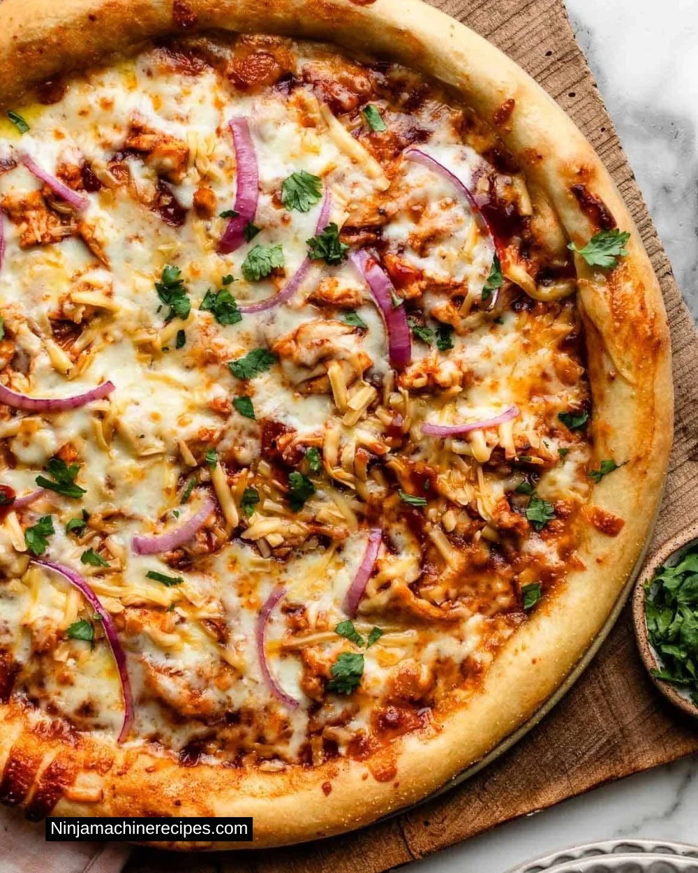 Delicious homemade BBQ chicken pizza topped with cheese and fresh ingredients