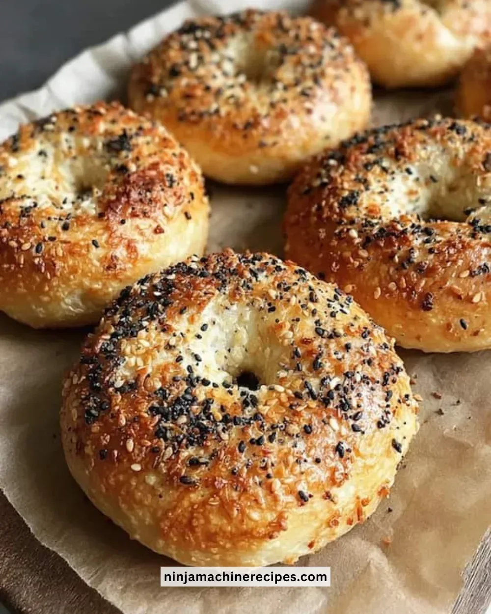 Freshly baked homemade New York bagels on a wooden table
