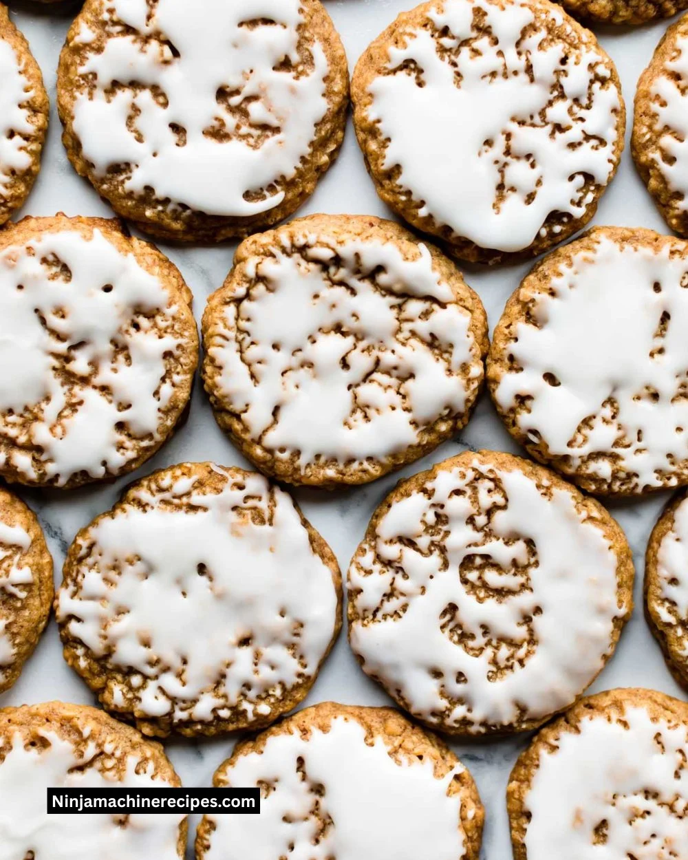 Delicious iced oatmeal cookies with a sweet glaze on a rustic wooden surface