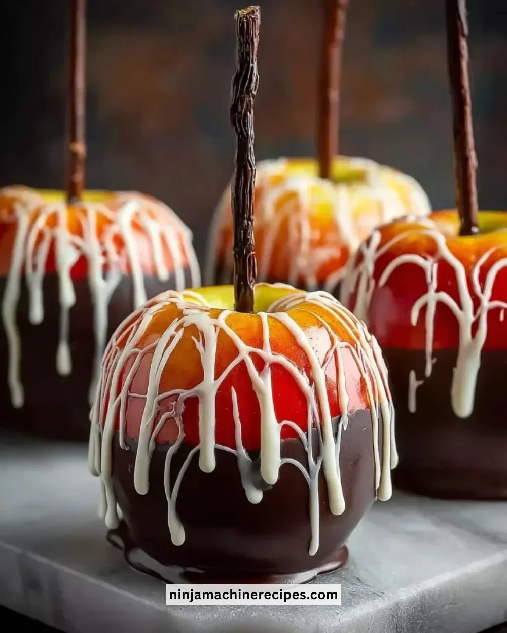 Marshmallow dipped apples drizzled with chocolate and sprinkles
