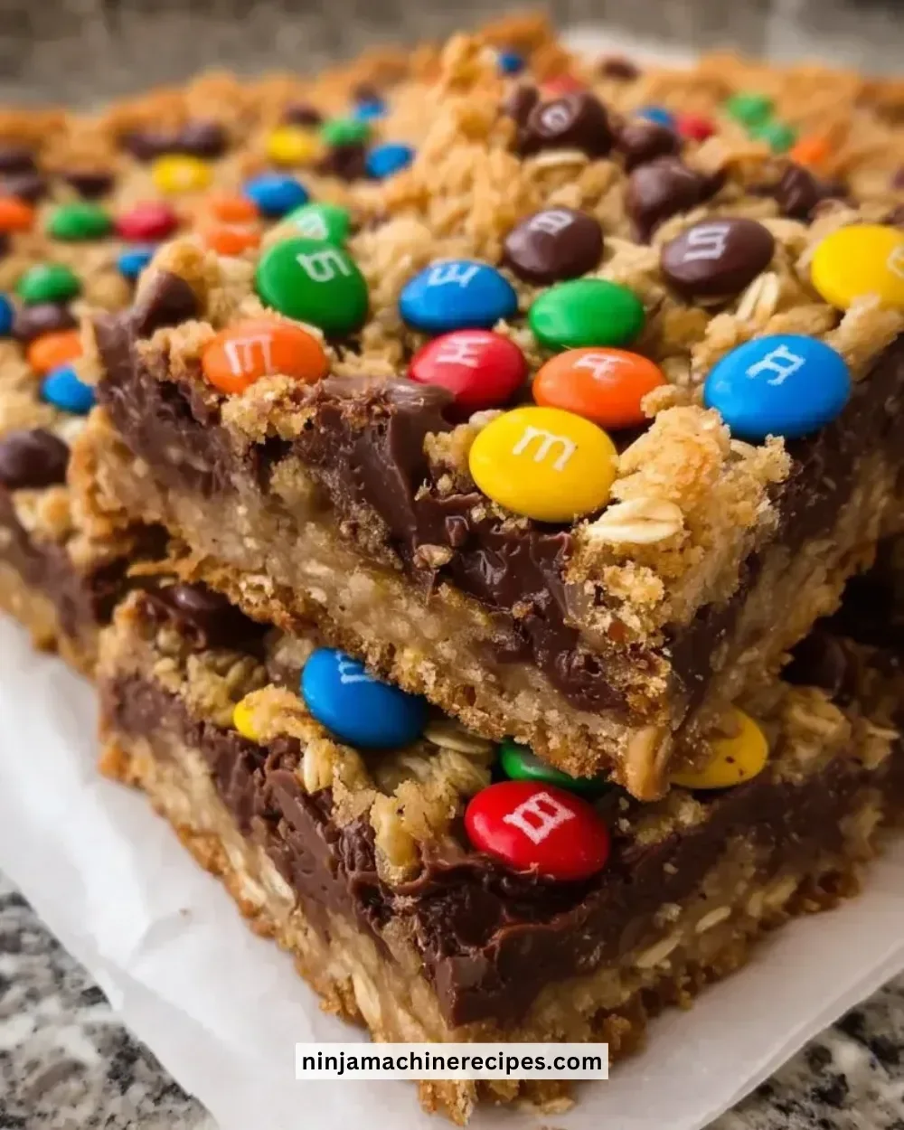 Delicious M&M chocolate fudge oatmeal bars topped with colorful candy.