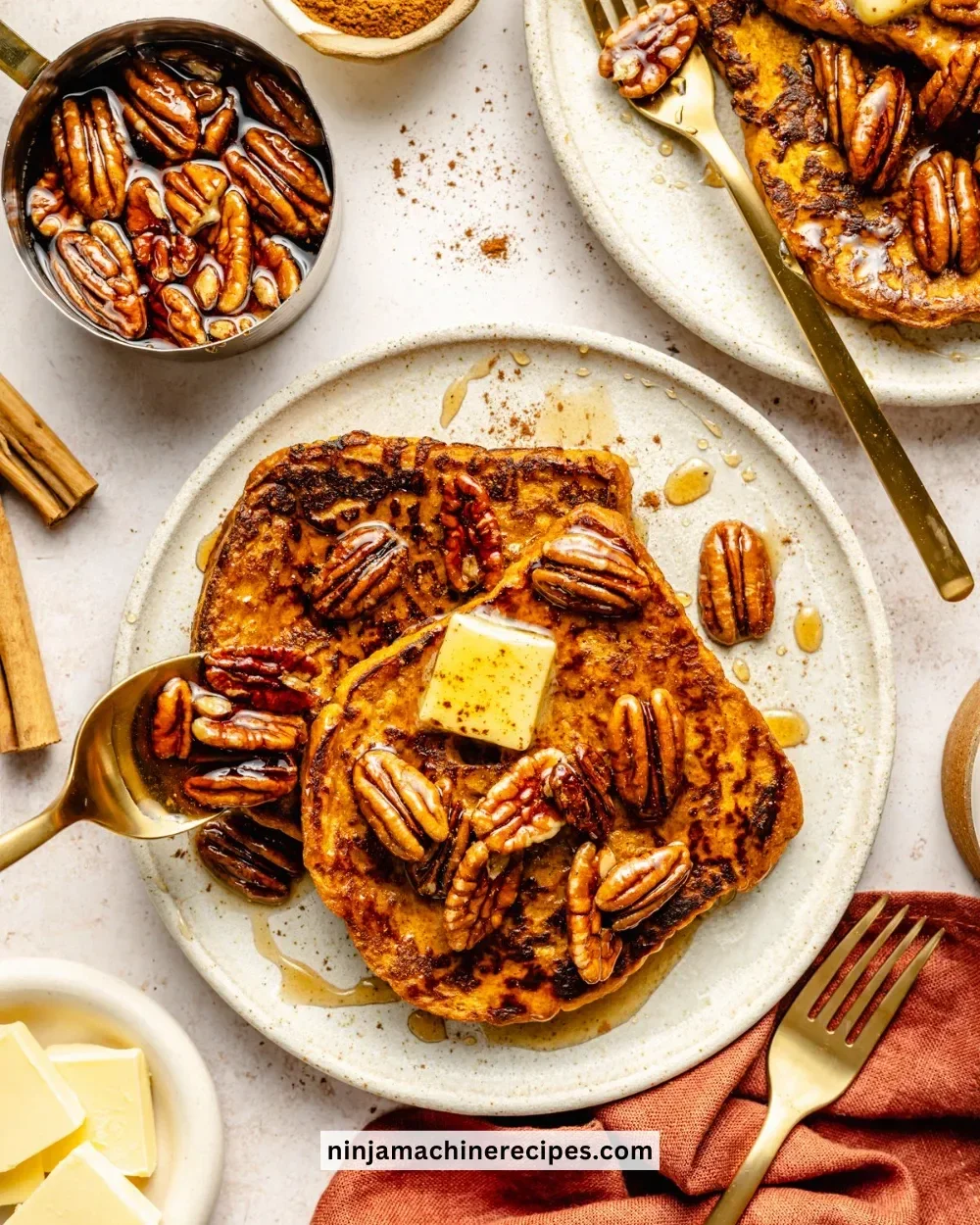Pumpkin French Toast with Spiced Pecan Syrup served on a plate